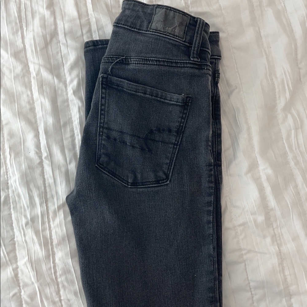 mid-rise, faded black jeans. slim fit